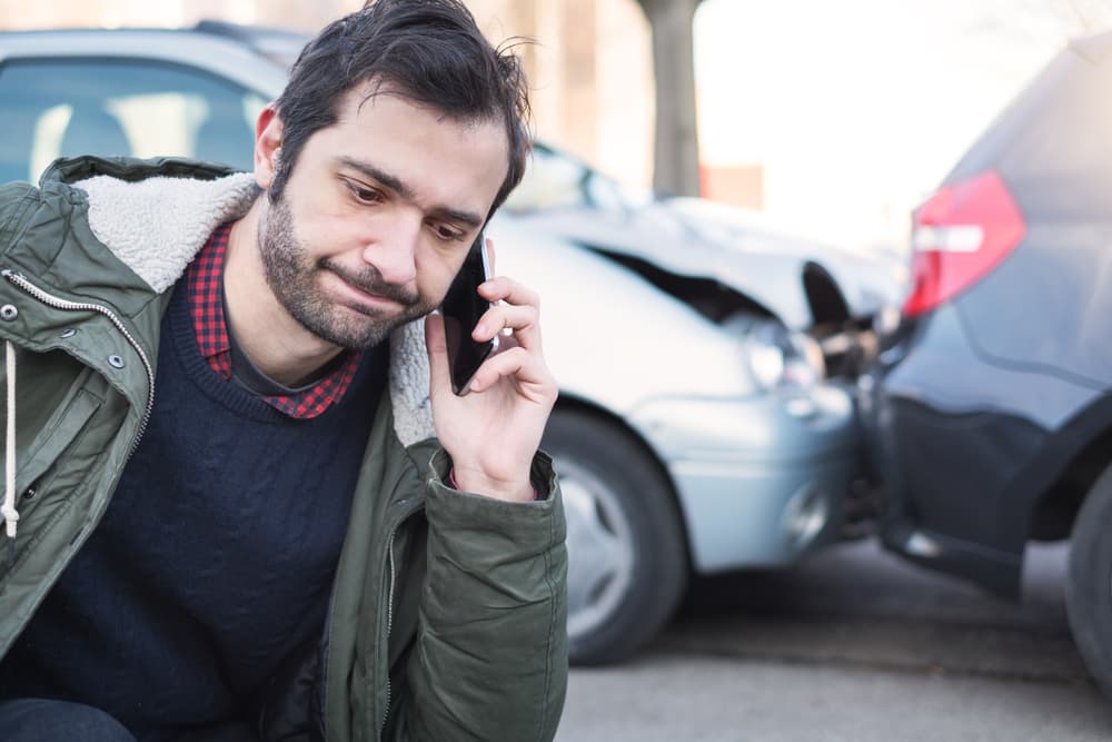 frustrated driver calling police after car accident