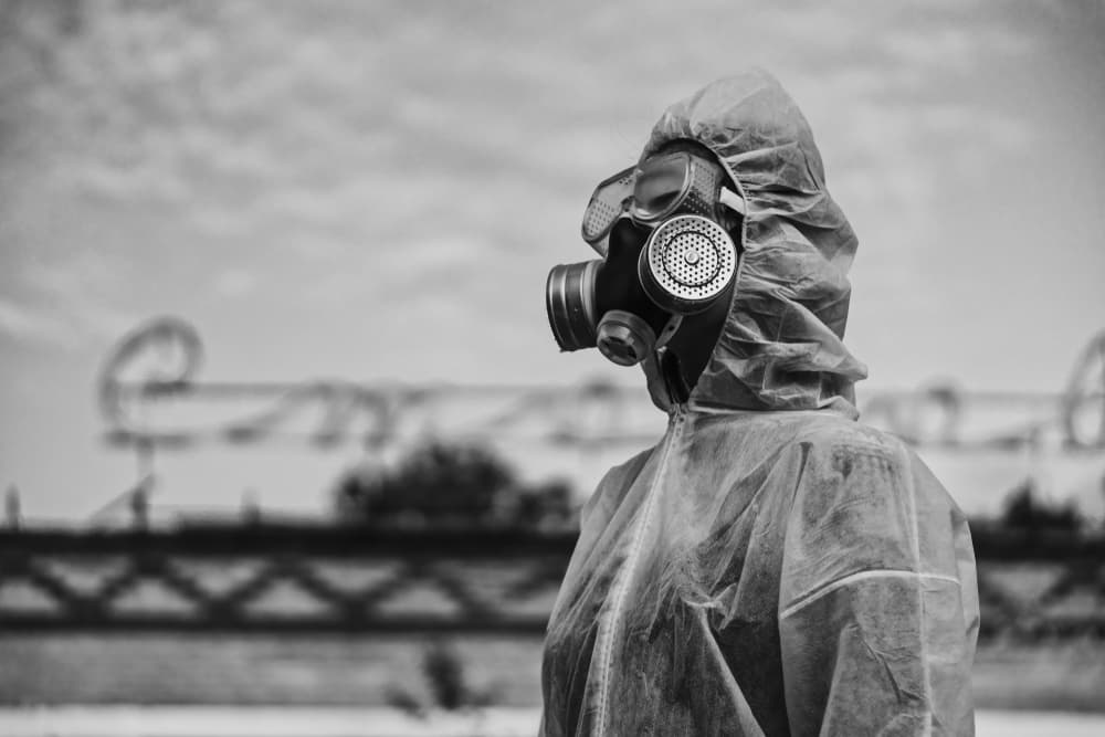 scientist with a white protective suit against radiation