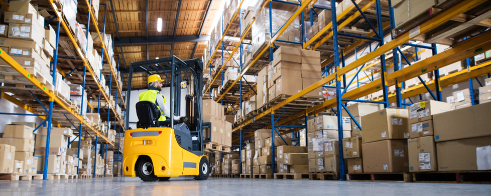 employee maneuvering forklift