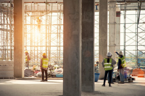 Construction Site view with workers hanging around