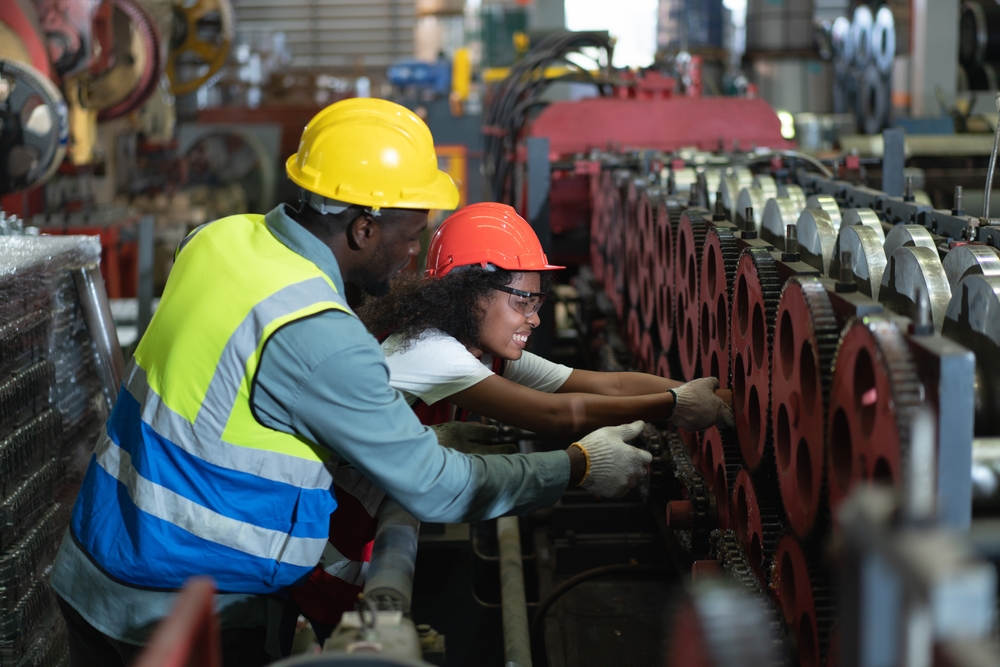 female with arm being crushed inside piece of machinery